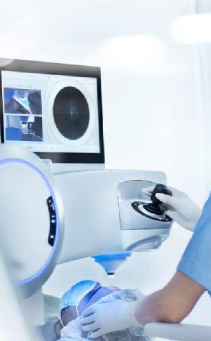 Surgeon operating a femtosecond laser console